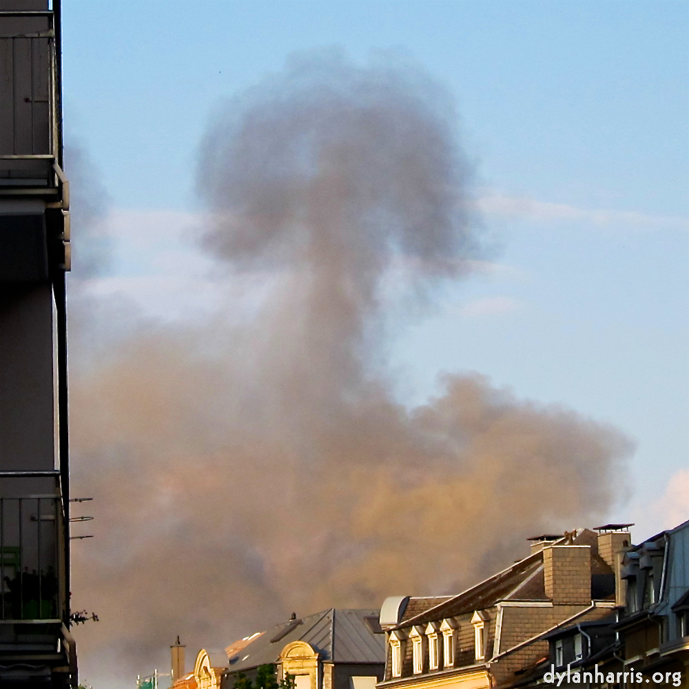 smoke rises from a penthouse fire