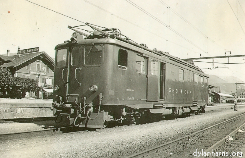 image: Metric Gauge Rack / Normal Electric Loco at Meiringen. Used on Interlaken - Meiringin - Giswil - etc. line. Photograph by Ray Burrows. 25 August 1948.