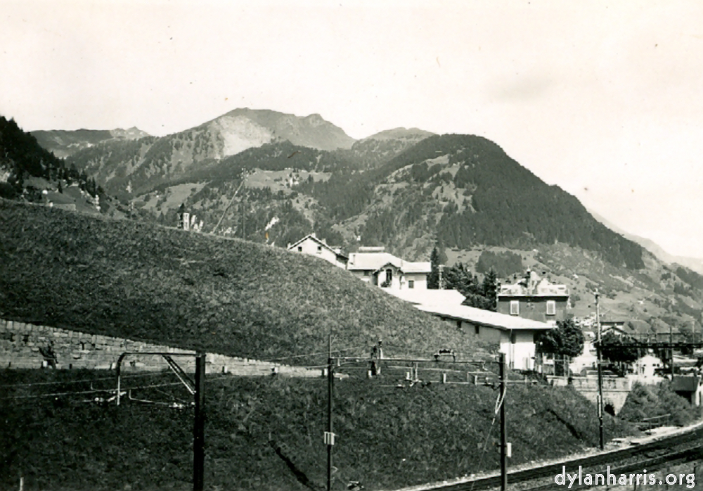 Photo: Looking East from Airolo. Shewing the Railway just about to enter the Southern end of the Gotthard Tunnel.